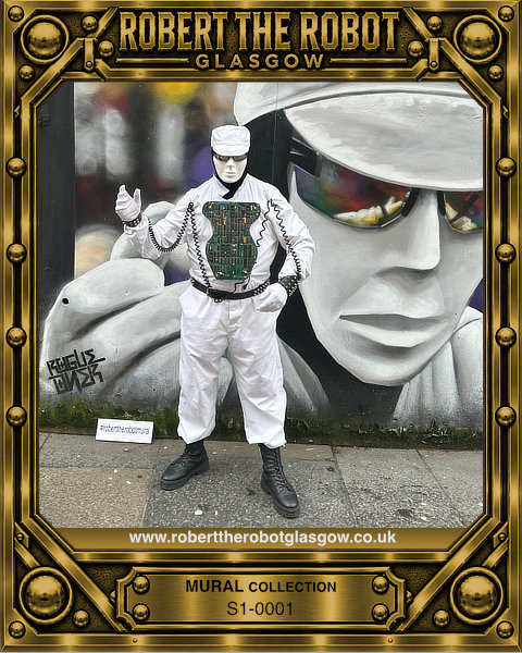 Robert the Robot Glasgow standing beside his mural in Miller Street, Glasgow.